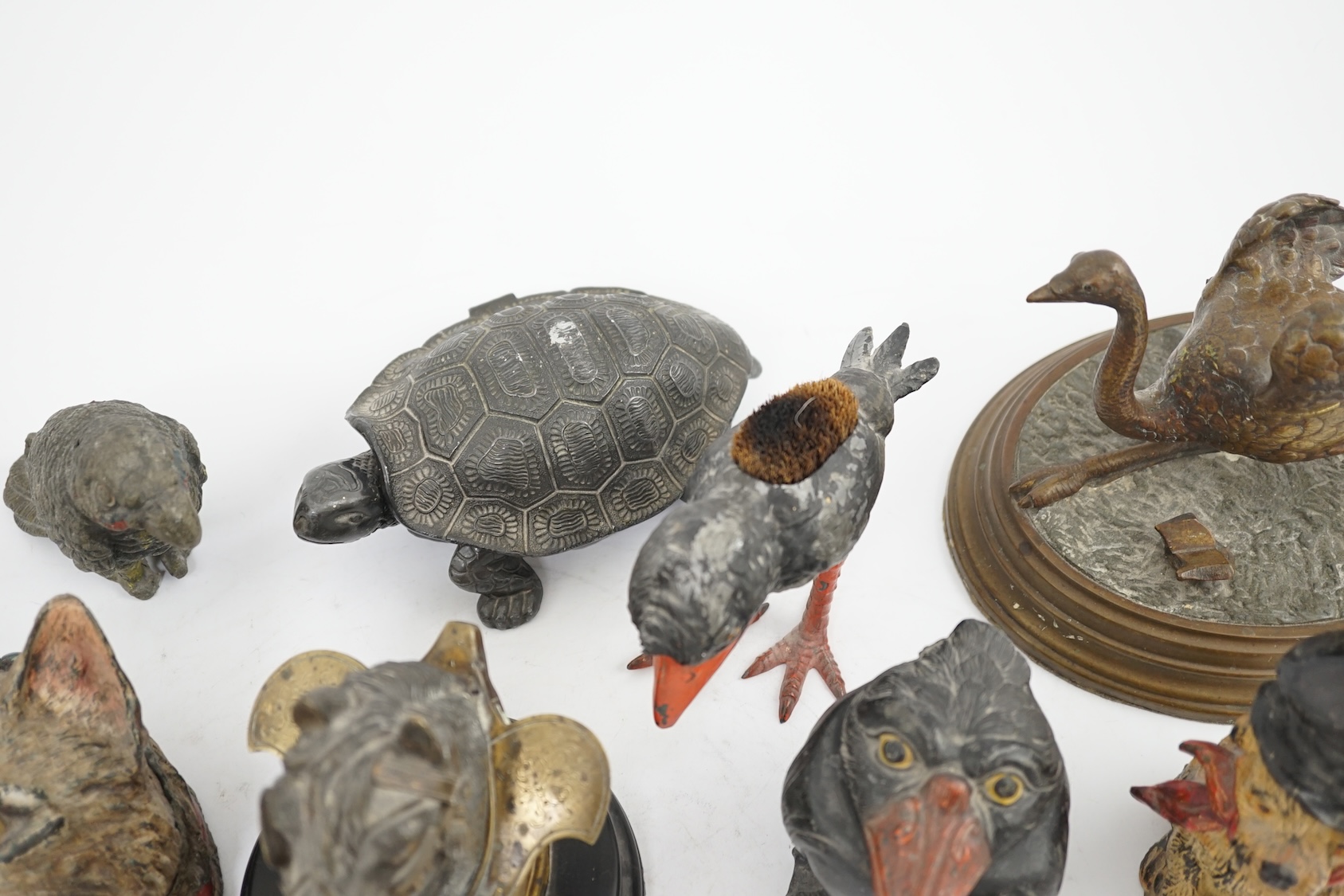A collection of nine 19th and 20th century novelty animal bronze and metal ink wells, including a Martin Brothers-style ‘Wally’ inkwell. Condition - minor chips due to use and age